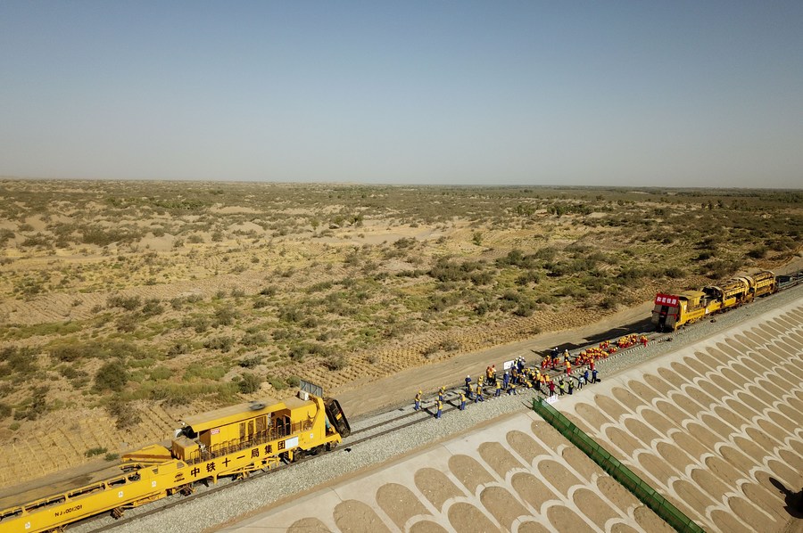 China to complete railway skirting largest desert