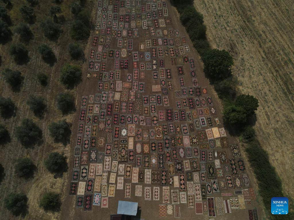 Hand-woven Turkish carpets exposed to sunlight in Antalya province, Türkiye