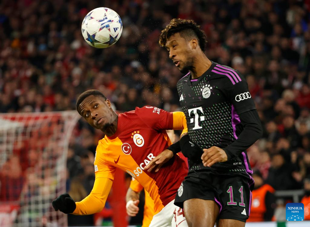 Galatasaray's Mauro Icardi, top, heads the ball with Manchester