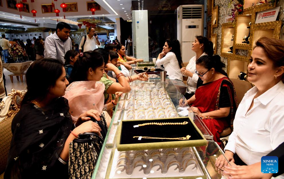 People seen shopping jewellery on the auspicious occasion of Hindu festival  Dhanteras celebration ahead of Diwali festival at P. P. Jewellers, Karol  Bargh.Indian people buying gold coin, jewellery, Silver, ornaments and coins