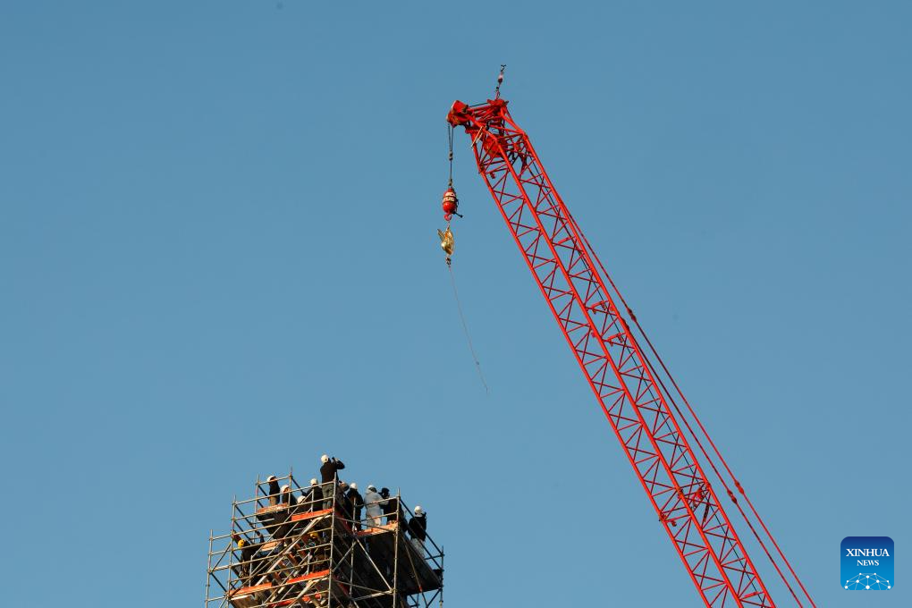 New Golden Rooster Fitted To Spire Of Paris' Notre Dame Cathedral