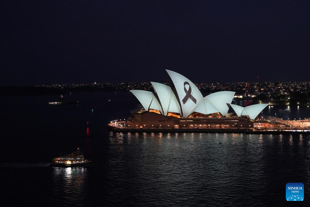 Sydney Opera House illuminated with black ribbon for victims of knife  attack-Xinhua
