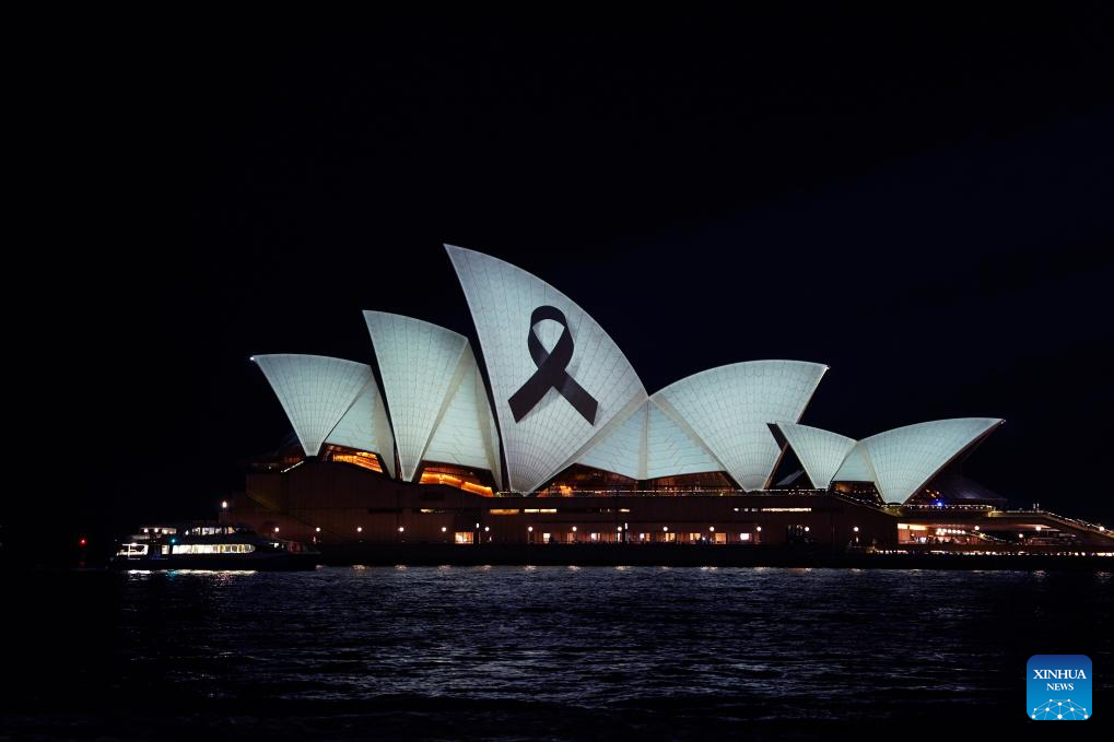 Sydney Opera House illuminated with black ribbon for victims of knife  attack-Xinhua