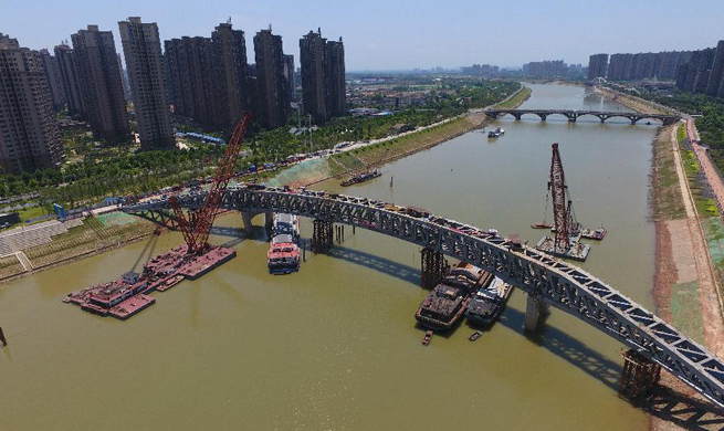 Pedestrian bridge across Liuyang River under construction in C China