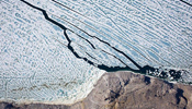 Huge ice island calves off Greenland glacier