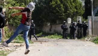 Palestinian protesters clash with Israeli soldiers near West Bank