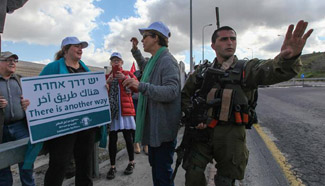 Israeli and Palestinian activists take part in protest
