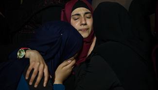 Relatives mourn Palestinian woman Sbateen shot by Israeli troops