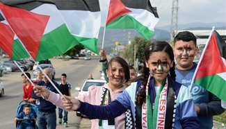 Israeli Arab demonstrators take part in Land Day rally