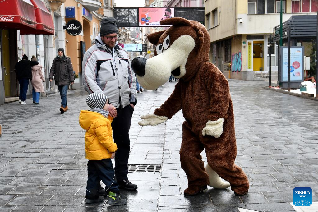 Mascot of 1984 Sarajevo Winter Olympics greets public on streets in ...