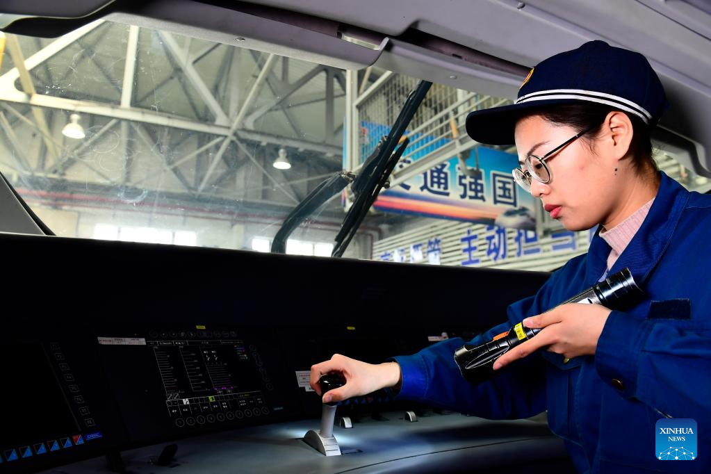 Young mechanists at Jinan bullet train service station maintain trains ...