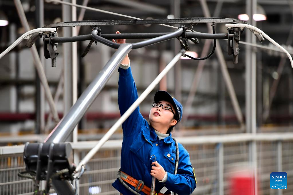 Young mechanists at Jinan bullet train service station maintain trains ...