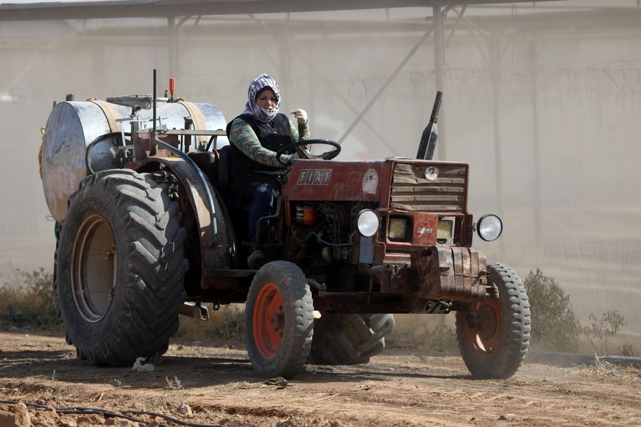 female farmer on tractor