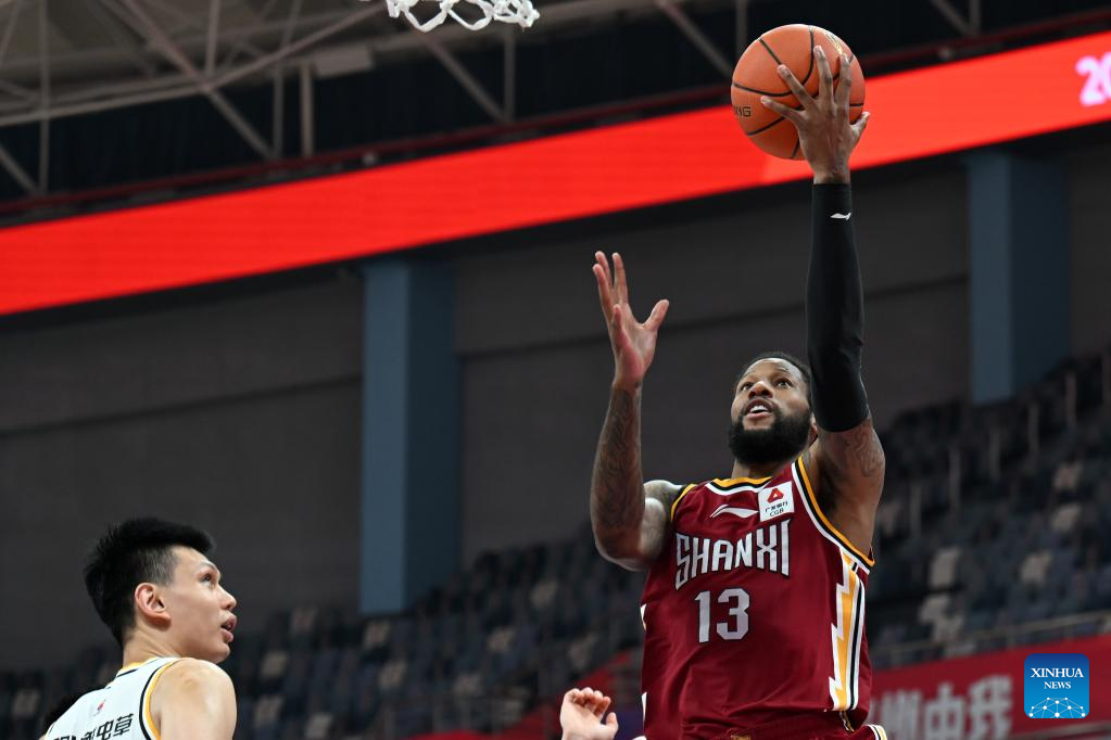 Qingdao(Shandong. 20th July, 2020. Ren Junwei (L) of Shanxi Loongs is  defended by Yang Jinmeng of Qingdao Eagles during a match between Shanxi  Loongs and Qingdao Eagles at the 2019-2020 Chinese Basketball