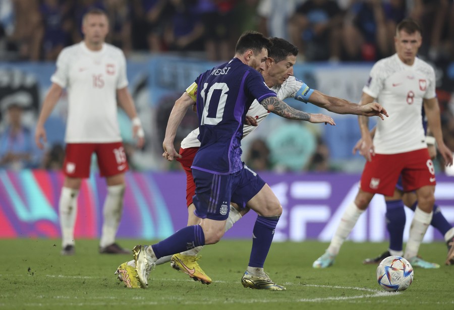 DOHA, QATAR - NOVEMBER 30: Player of Argentina Nahuel Molina drives the  ball during the FIFA World Cup Qatar 2022 group C match between Argentina  and Poland at Stadium 974 on November