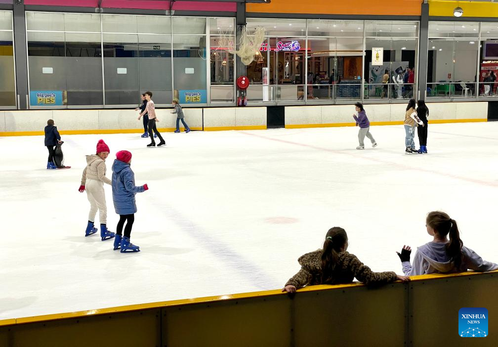 People skate at ice rink in Johannesburg, South AfricaXinhua