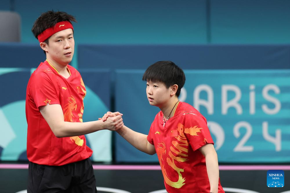 Olympics China's Wang/Sun to reach table tennis mixed doubles semis