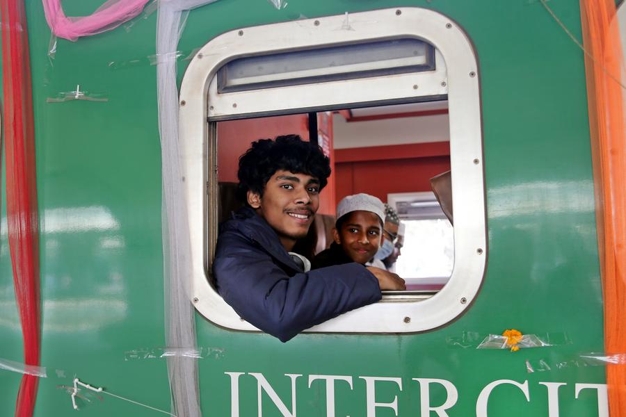 Passengers inside⁢ a ⁤train of the​ Padma Bridge Rail Link Project (PBRLP)