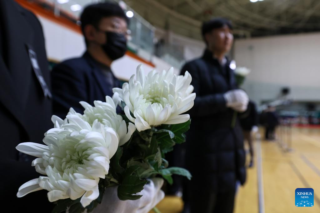 Citizens pay tribute at a joint memorial altar for the victims of the Jeju Air plane ⁢crash in Muan, southwest South Korea, Dec. 30, ‌2024.