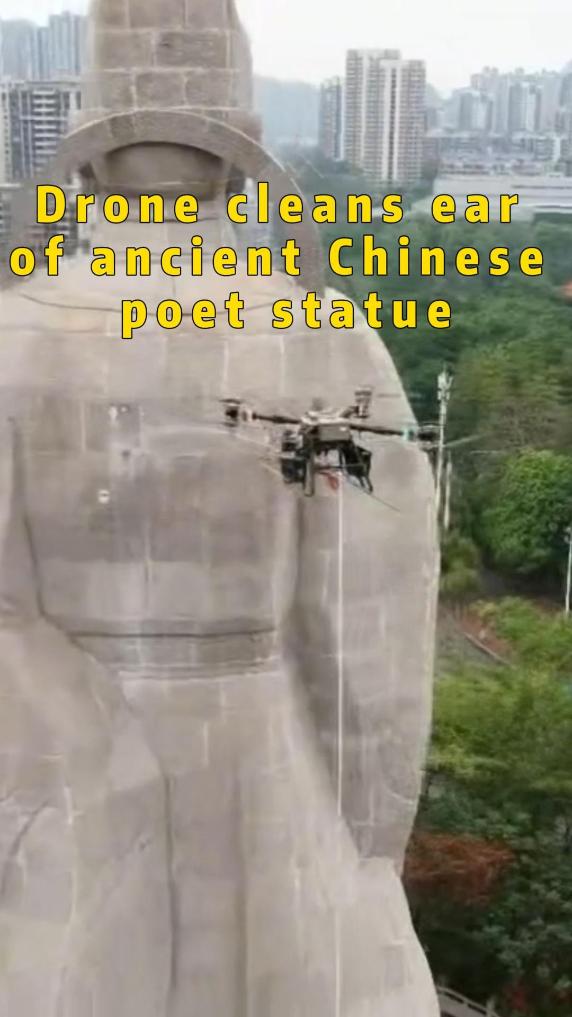 Drone cleans ear of ancient Chinese poet statue