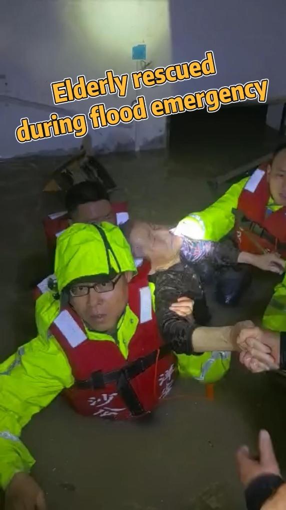 Police pry open door to rescue elderly from floodwaters
