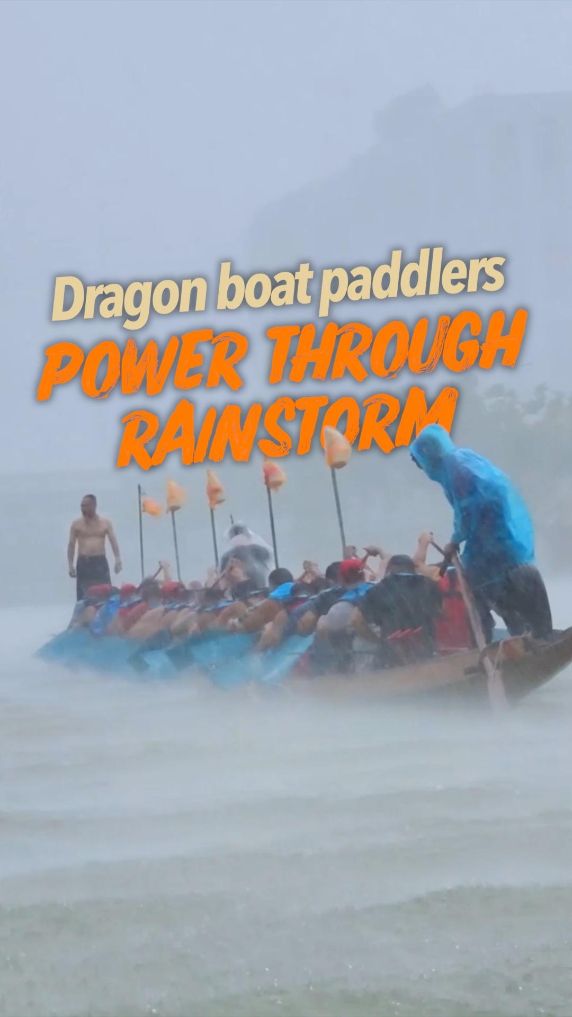 Dragon boat paddlers power through rainstorm 