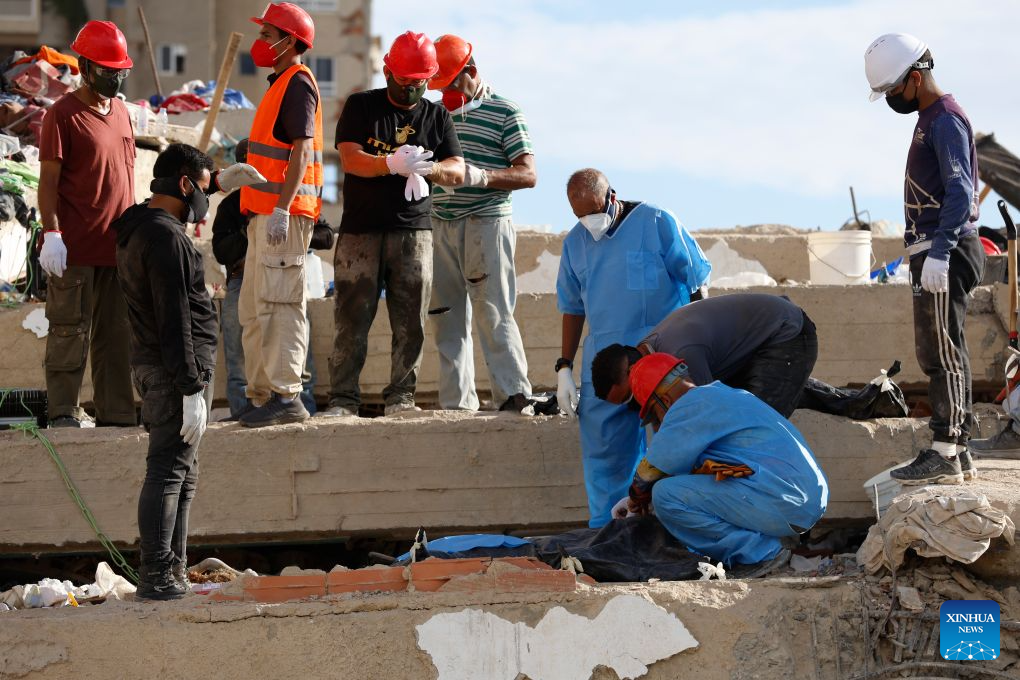 Rescuers recover a victim’s body from the rubble of a collapsed building in Caraballeda, La Guaira state, Venezuela, June 28, 2026