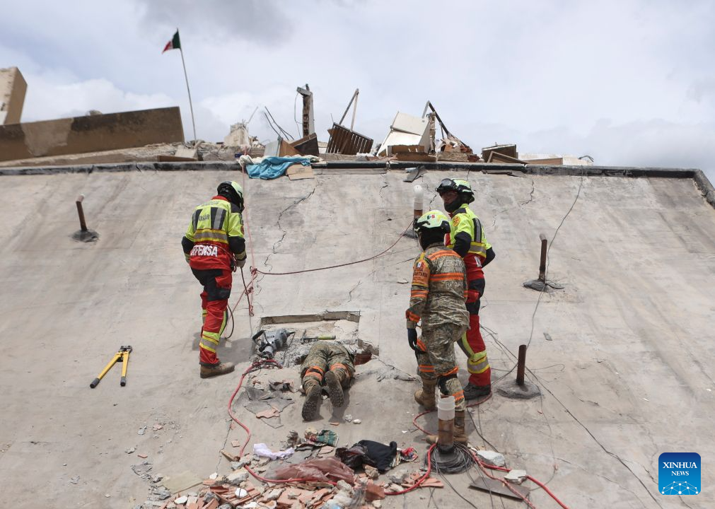 Rescuers work on a collapsed building in Playa Grande, La Guaira state, Venezuela, June 28, 2026