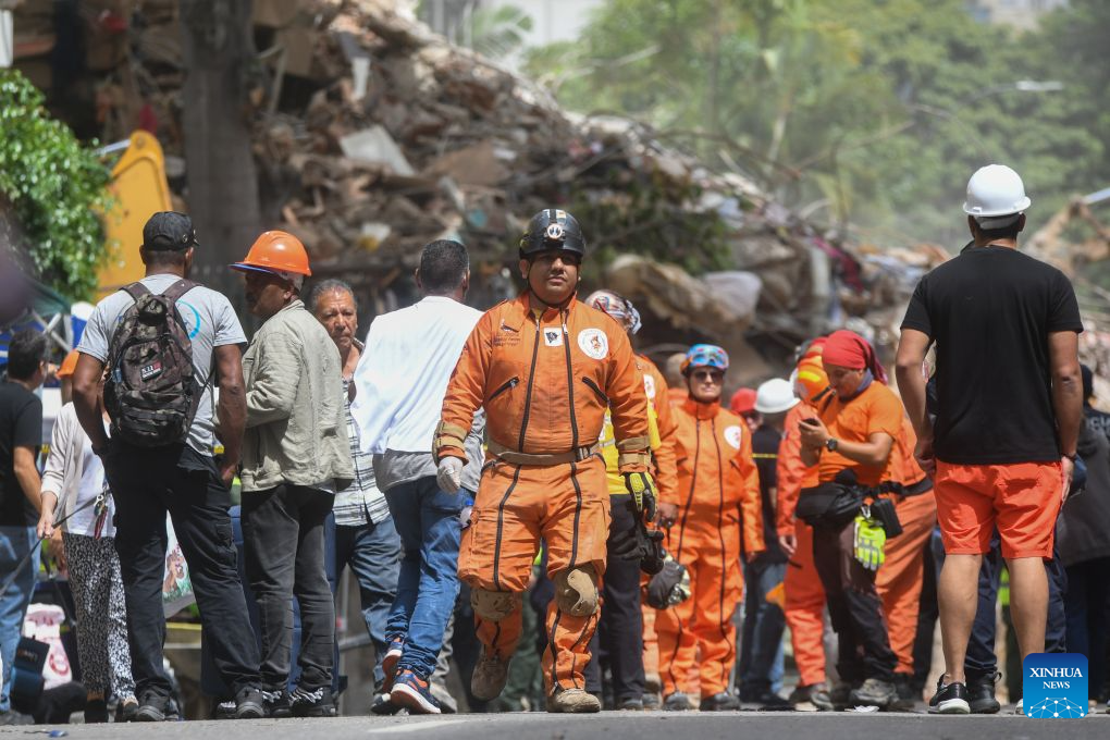 Rescuers near a collapsed building in Chacao, Venezuela, on June 28, 2026