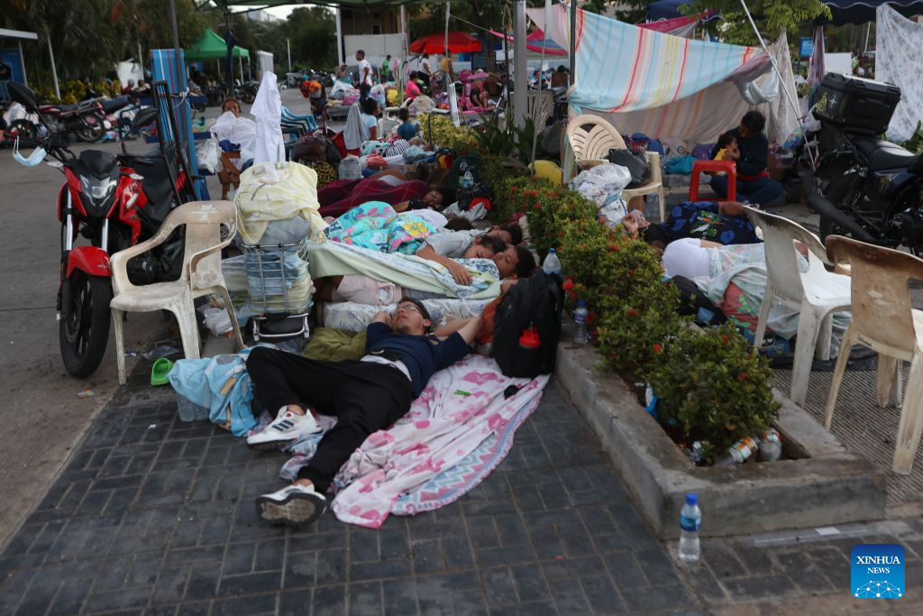 People affected by earthquakes rest on a square in Caraballeda, La Guaira state, Venezuela, June 28, 2026