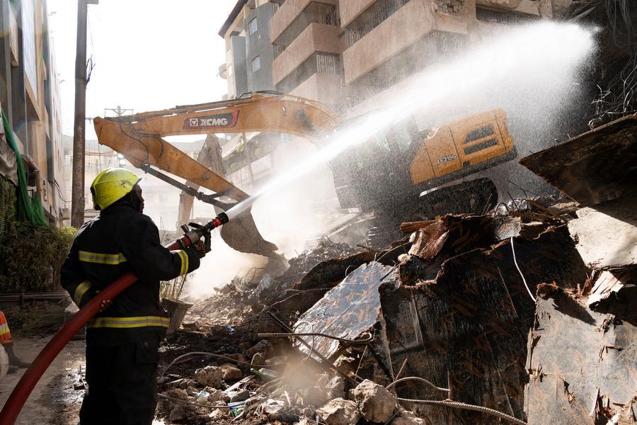 Chinese rescue team detects signs of life beneath collapsed building in ...