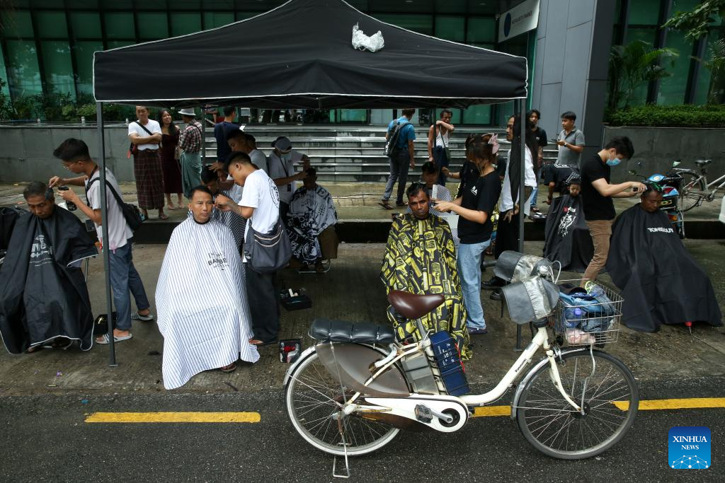 Feature: Young hairdressers offer free haircuts in Myanmar's Yangon to ...