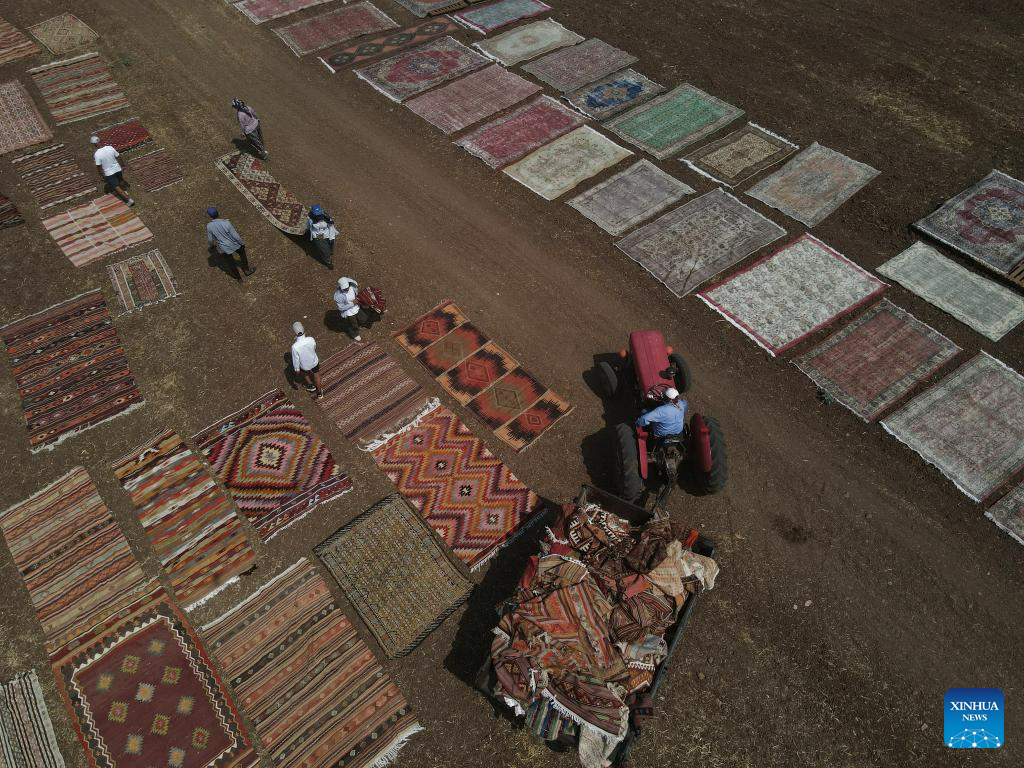 Hand-woven Turkish carpets exposed to sunlight in Antalya province ...