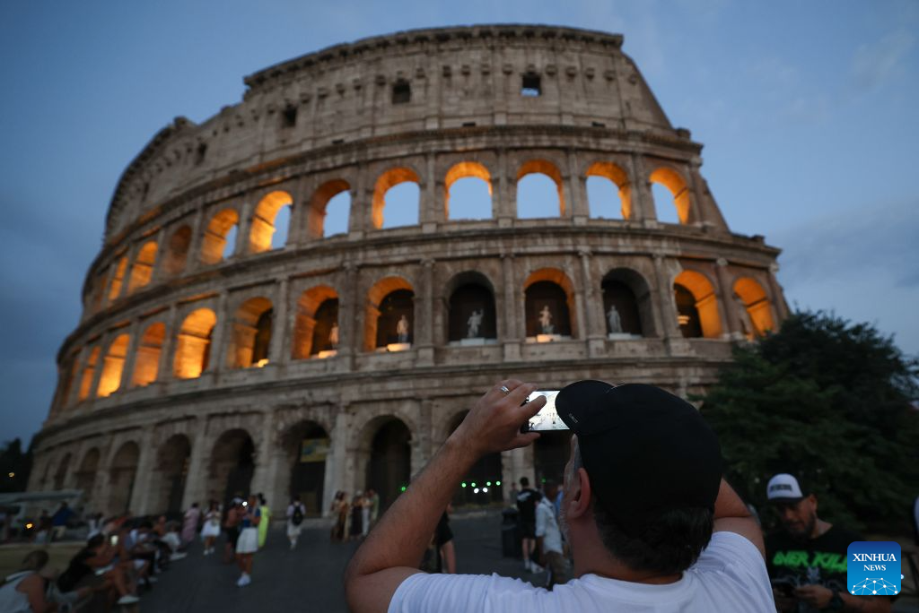 Visitors explore the Colosseum during official night tours in Rome-Xinhua